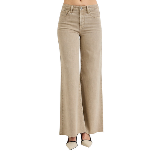 These High Rise Lurex Palazzo Pants from Risen feature a sophisticated taupe khaki color and a flattering high-rise design with built-in tummy control. Crafted to enhance your silhouette while offering comfort, they provide a sleek and polished look perfect for both professional and casual settings. The palazzo cut ensures ease of movement and a modern style that stands out effortlessly.