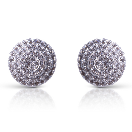 Expertly crafted with sparkling rhinestone accents and high-quality cubic zirconia, these Pave Circle Stud Earrings are a luxurious addition to your jewelry collection. Designed with a sleek silver finish and a classic circle shape, these earrings add timeless elegance to any outfit. Elevate your style with these stunning studs.