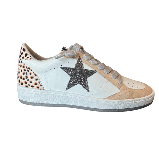 Be the talk of the town with Paz, a statement-making sneaker crafted by premium shushop brand. This shoe features a grey star accent and cheetah hair accent on a beige base, giving you an edgy and chic look. With Paz, you will be walking in style.