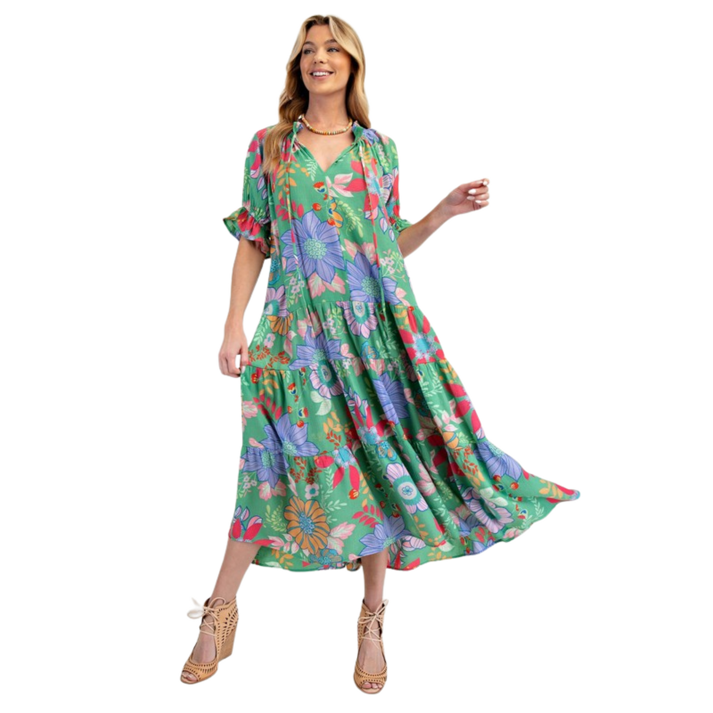 Introducing the Peach Blossom Maxi Dress, designed with plus size women in mind. Featuring a beautiful printed design, bubble short sleeves with ruffle ends, and a notched V neck with adjustable tie closure for the perfect fit. With a tiered and ruched bottom, this relaxed and loose fitting dress is both comfortable and stylish. And for added convenience, it also includes side pockets. From the trusted Easel brand, this green dress is a must-have for any wardrobe.