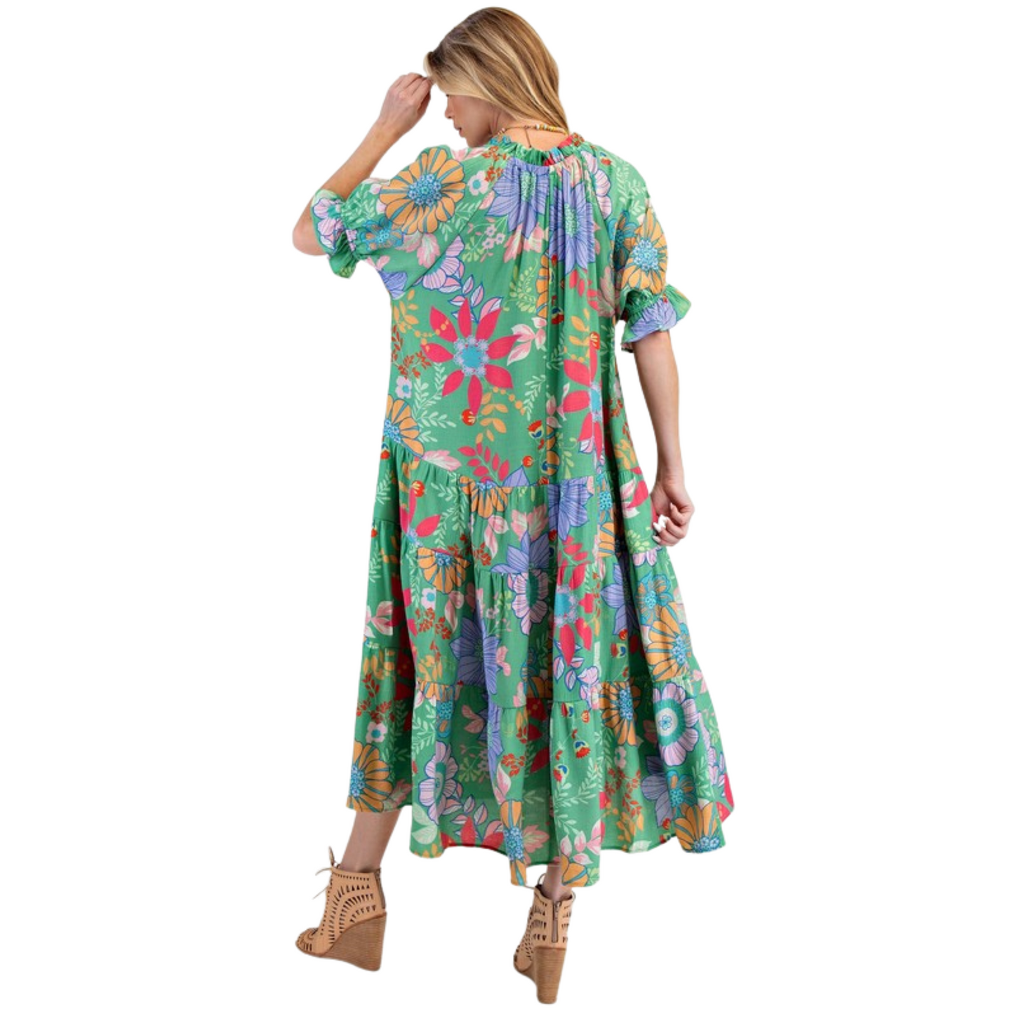 Introducing the Peach Blossom Maxi Dress, designed with plus size women in mind. Featuring a beautiful printed design, bubble short sleeves with ruffle ends, and a notched V neck with adjustable tie closure for the perfect fit. With a tiered and ruched bottom, this relaxed and loose fitting dress is both comfortable and stylish. And for added convenience, it also includes side pockets. From the trusted Easel brand, this green dress is a must-have for any wardrobe.