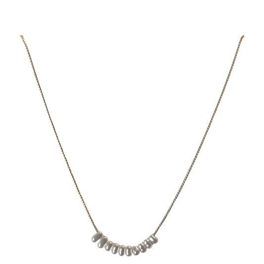 This small pearl accent necklace is perfect for any look. Crafted with a lightweight gold chain and tiny pearl accents, it's delicately dainty and effortlessly stylish. Show off your unique sophistication with this perfect piece.