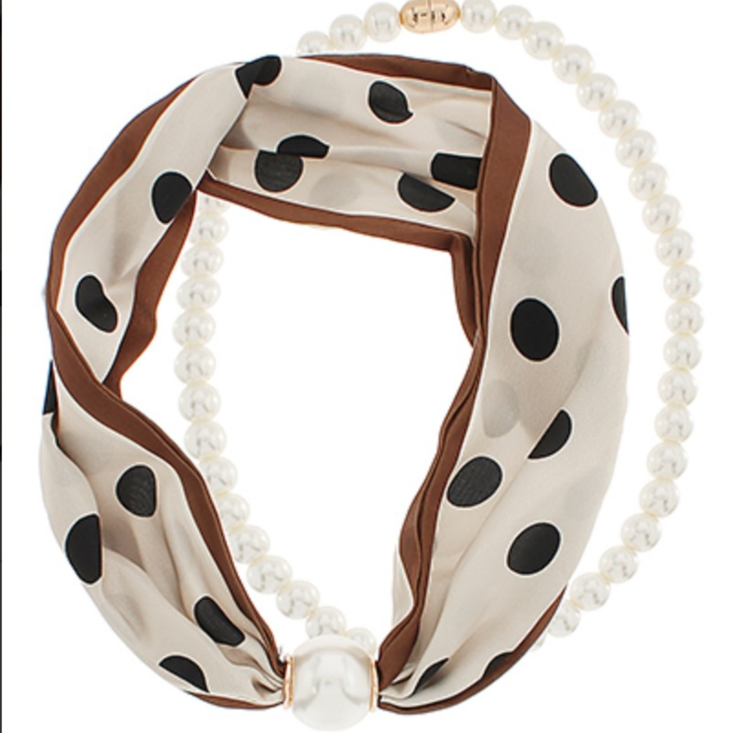 Elevate your accessory game with this stunning scarf necklace from Golden Stella. Crafted in soft beige and rich brown tones, it features playful black polka dots throughout for a timeless, versatile look. Delicate pearl accents add sophistication, while the secure magnetic pearl closure ensures easy on-and-off wear. Perfect for layering or wearing solo, this piece transitions seamlessly from casual to dressy occasions. 
