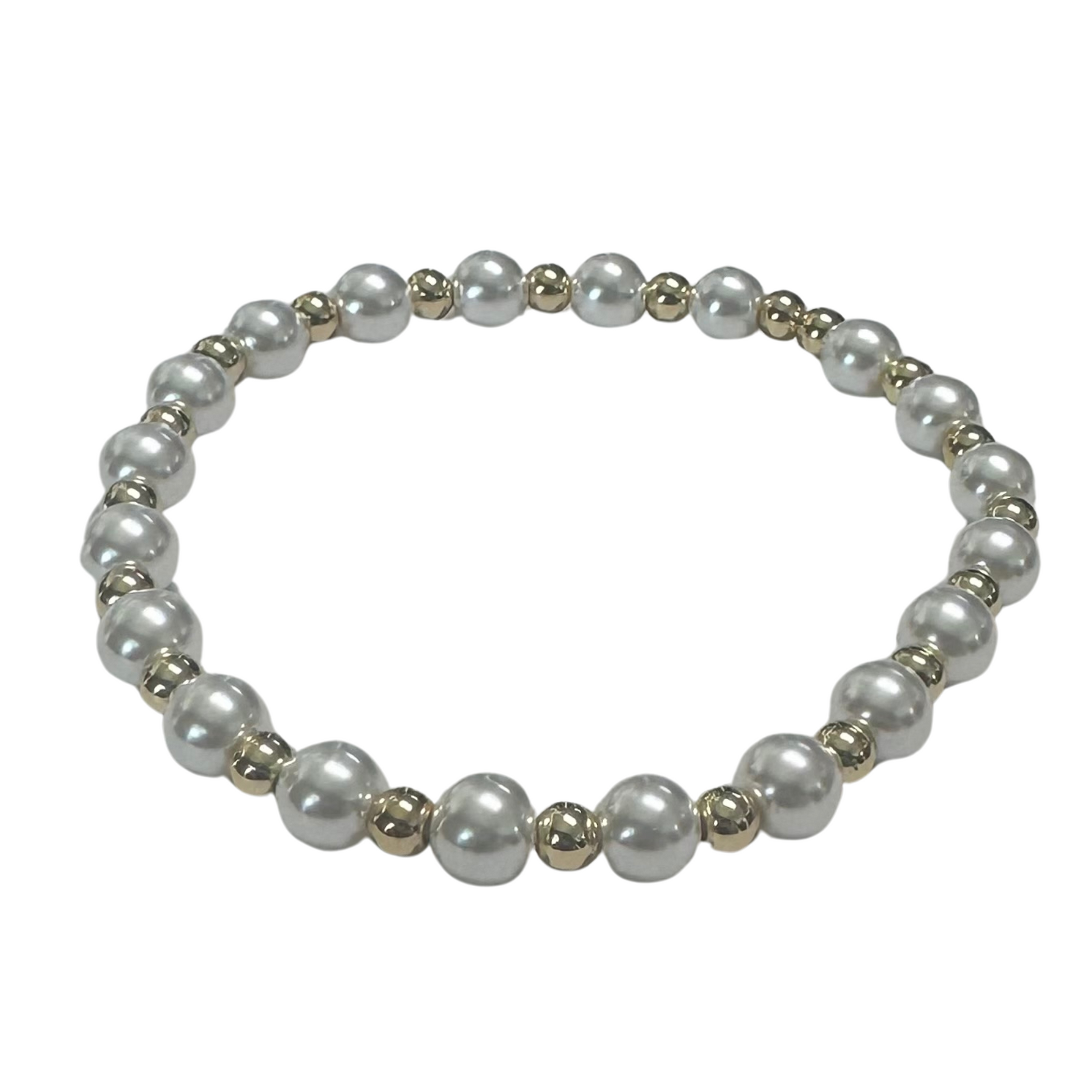 Pearl stretchy bracelet with small gold beads