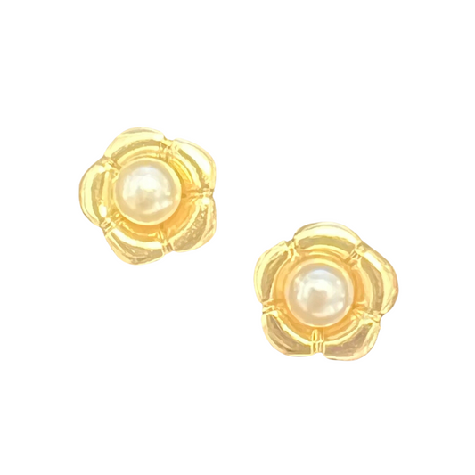 Adorn your ears with these elegant flower-shaped stud earrings. Crafted from gold-colored metal and featuring a single pearl accent, these tasteful earrings will add a touch of sophistication to any look.