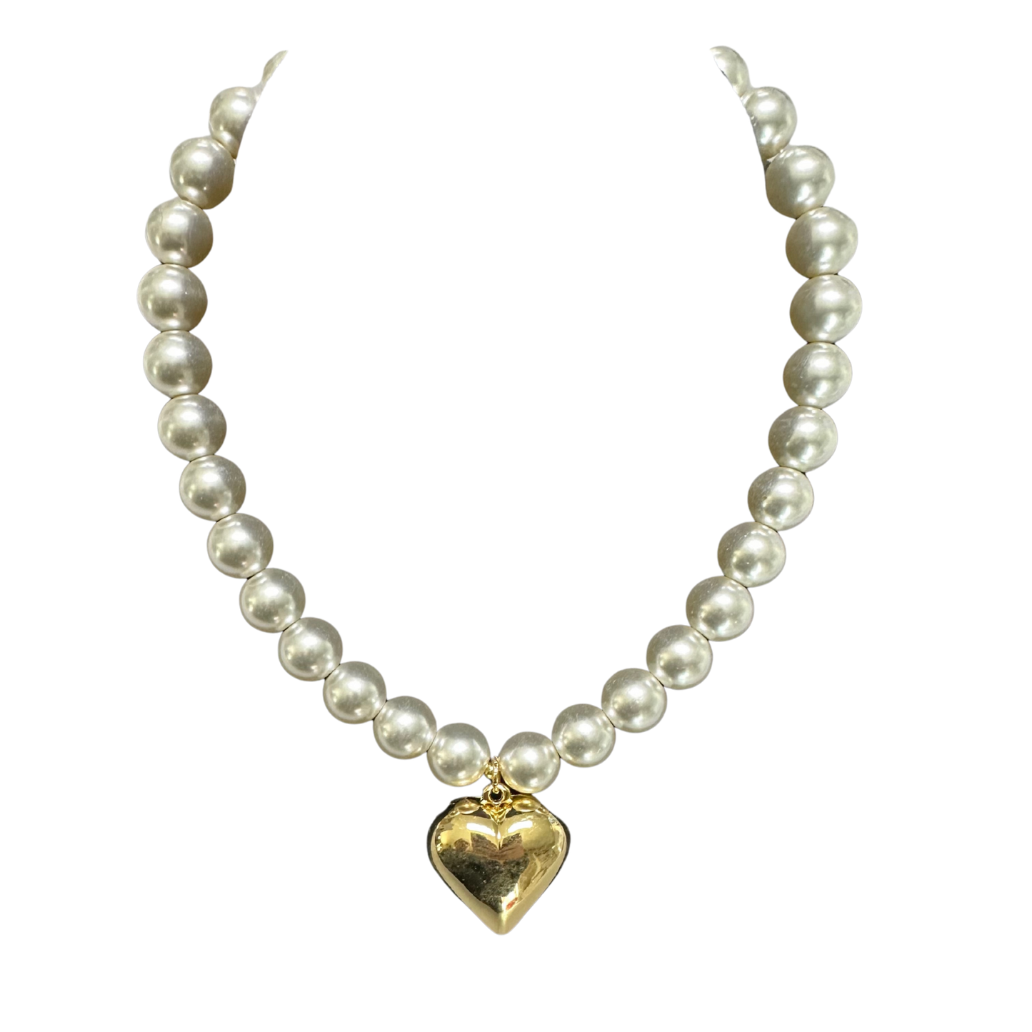 Elevate your everyday elegance with this exquisite Pearl Heart Necklace from Perdido Gems. Featuring a lustrous gold heart pendant suspended from a delicate short chain, this piece seamlessly transitions from casual to formal occasions. The timeless combination of pearl accents and warm gold tones creates a sophisticated aesthetic that complements any complexion. Perfect for layering or wearing solo, this necklace offers versatile styling options for the discerning jewelry collector. A refined addition to y