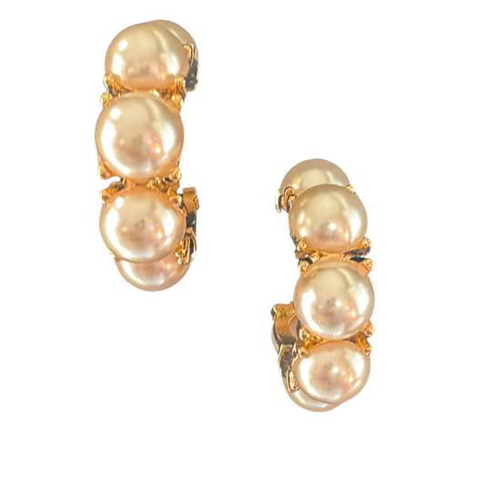 These Pearl Hoop Earrings feature a classic gold design with large pearl accents. Elevate any outfit with these elegant and timeless earrings. Crafted with quality materials, they offer a luxurious touch to your style. Perfect for any occasion, these earrings are a must-have addition to your jewelry collection.