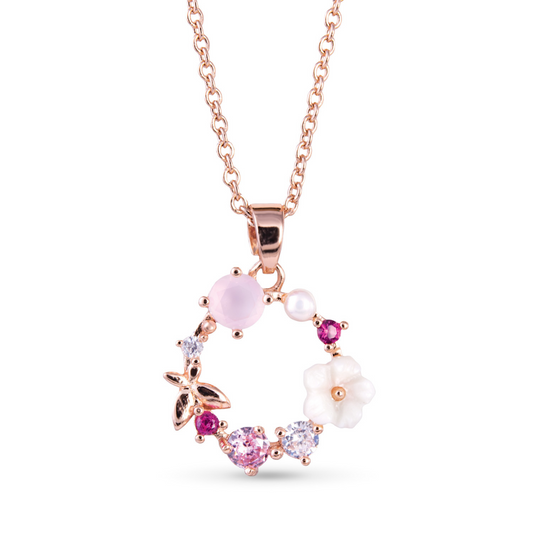 This stunning Pearl Multicolor Necklace features a delicate rose gold chain adorned with lustrous pearl accents. The circle pendant adds a touch of elegance, while the floral designs add a feminine touch. Elevate any outfit with this timeless and versatile piece.