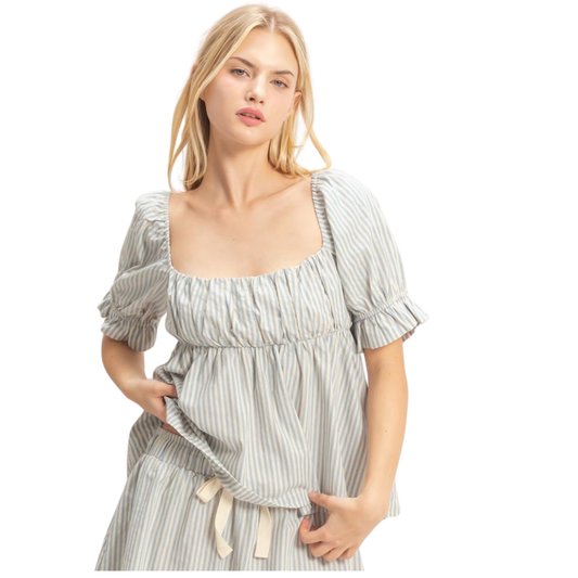 Elevate your wardrobe with this stunning sky blue striped peplum top by HYFVE. The square neckline frames your shoulders beautifully, while the open back design adds an unexpected touch of allure. Perfect for casual outings or dressed up for evening events, this piece combines classic style with modern flair. The crisp stripes and flattering silhouette make it a versatile essential for any season.