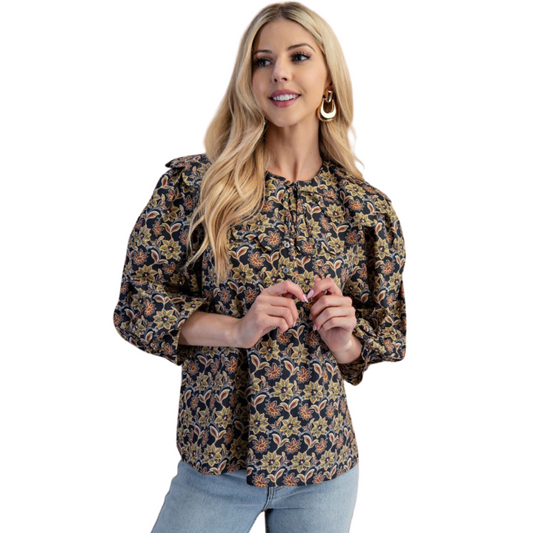 This GiGio top features a distinctive black abstract print and elegant 3/4 length sleeves, combining sophistication with comfort. Its scalloped Peter Pan collar adds a refined vintage touch, making it ideal for both professional and casual settings. The design balances classic charm with modern style, offering versatile wear for various occasions.