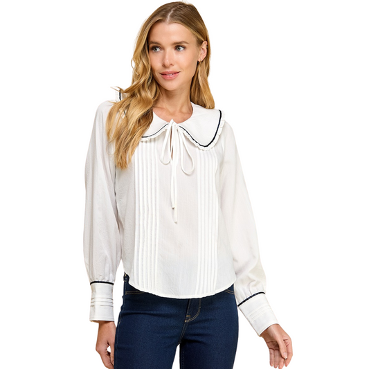 This Peter Pan Collar Top, by TCEC, features a classic white color and pleated design, exuding timeless elegance. With long sleeves for added warmth and style, this top is a versatile addition to any wardrobe.