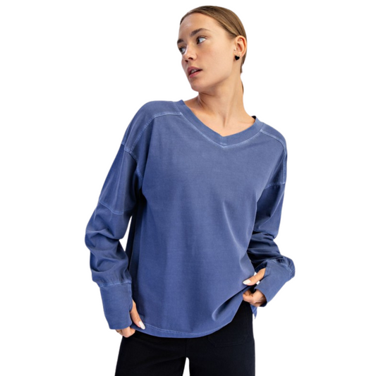 Experience timeless comfort with the Pigment Washed V-Neck Top by Rae Mode. This navy long-sleeve features a flattering V-neckline and a soft pigment-washed finish that adds subtle vintage character. Its lightweight, breathable fabric ensures all-day wearability, making it an essential layering piece for a refined casual wardrobe.