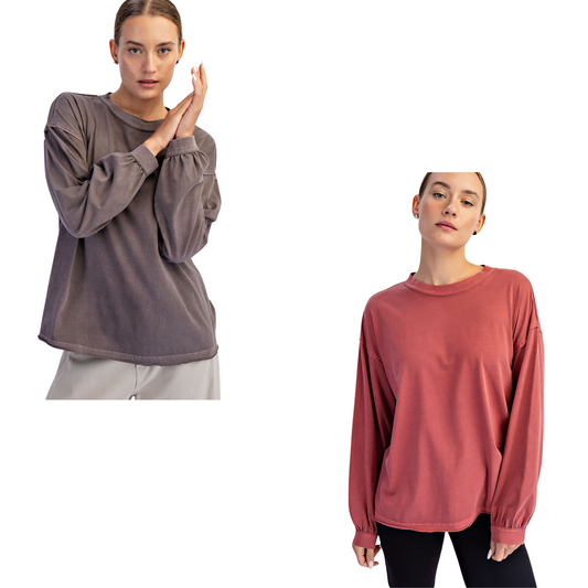 This Pigment Washed Top by Rae Mode features long sleeves and a classic crew neck for timeless appeal. Available in mocha and winter berry, its washed colors offer a soft, lived-in look and feel. Perfect for layering or wearing alone, this top combines comfortable style with versatile seasonal tones.