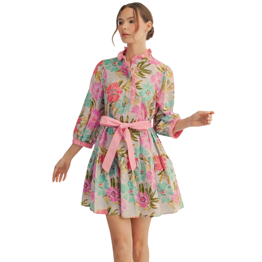 Embrace effortless elegance with this charming Jodifl tiered floral mini dress. Featuring a soft pink floral mix print, this piece combines romantic style with practical comfort. The front button-up design allows for easy layering and adjustable coverage, while the fitted waist tie cinches your silhouette beautifully. Three-quarter length sleeves provide the perfect balance of coverage and breathability, making it ideal for transitional seasons. 