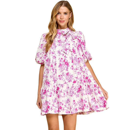 Add a touch of femininity to your wardrobe with our Floral Print Puff Sleeve Dress from TCEC. The elegant pink floral print and charming bow accent make this dress a must-have for any occasion. Experience the confidence and style that comes with owning this beautiful TCEC dress.