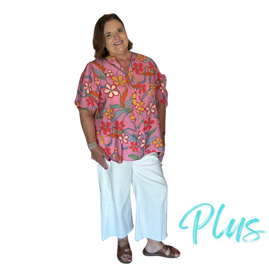 This plus size pink Puff Sleeve Printed Top from Easel features a delicate floral print and a flattering V-neckline. The puff sleeves add a touch of volume and elegance, making it a versatile piece for both casual and dressier occasions. Crafted with attention to detail, this top combines feminine style with comfortable wearability.