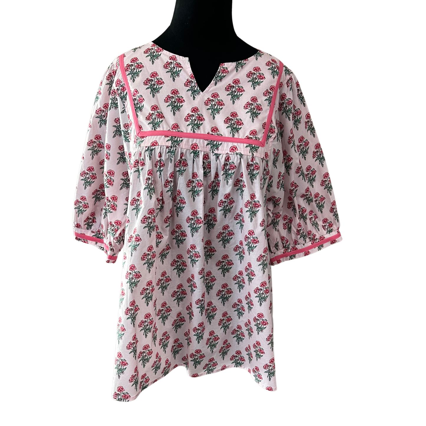 Embrace effortless style with this charming half-sleeve top from She+Sky. The soft pink floral print brings a fresh, feminine touch to your everyday wardrobe, while the flattering V-neckline and relaxed fit offer comfort and confidence. Perfect for layering or wearing solo, this plus-size essential transitions seamlessly from casual outings to relaxed gatherings. Quality crafted for all-day wear.