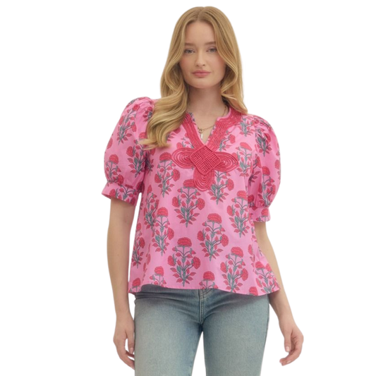 Elevate your wardrobe with this charming Puff Sleeve V-Neck Top by Entro. Featuring a delicate pink floral print, this piece combines feminine style with everyday versatility. The flattering v-neckline and soft puff sleeves create a romantic silhouette perfect for casual outings, brunch dates, or layering under your favorite jacket. Crafted with quality construction, this top pairs effortlessly with jeans, skirts, or trousers for a polished look that transitions seamlessly from day to night.