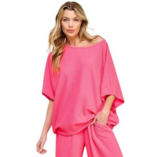 Experience ultimate comfort and effortless style with our Striped Oversized Top. Designed with a ribbed knit texture and a versatile pink kosmos color, this top is perfect for any occasion. Its oversized and loose fit provides a flattering silhouette for all body types.