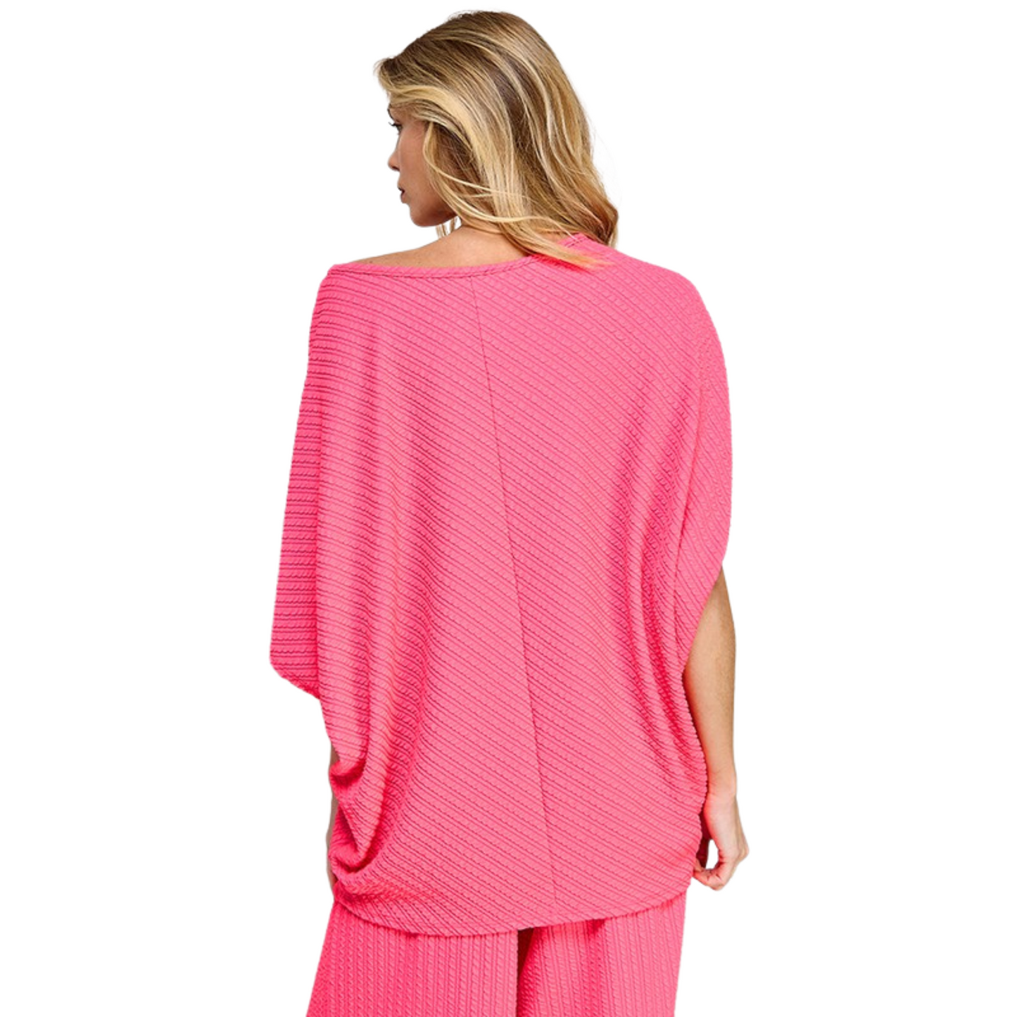 Experience ultimate comfort and effortless style with our Striped Oversized Top. Designed with a ribbed knit texture and a versatile pink kosmos color, this top is perfect for any occasion. Its oversized and loose fit provides a flattering silhouette for all body types.