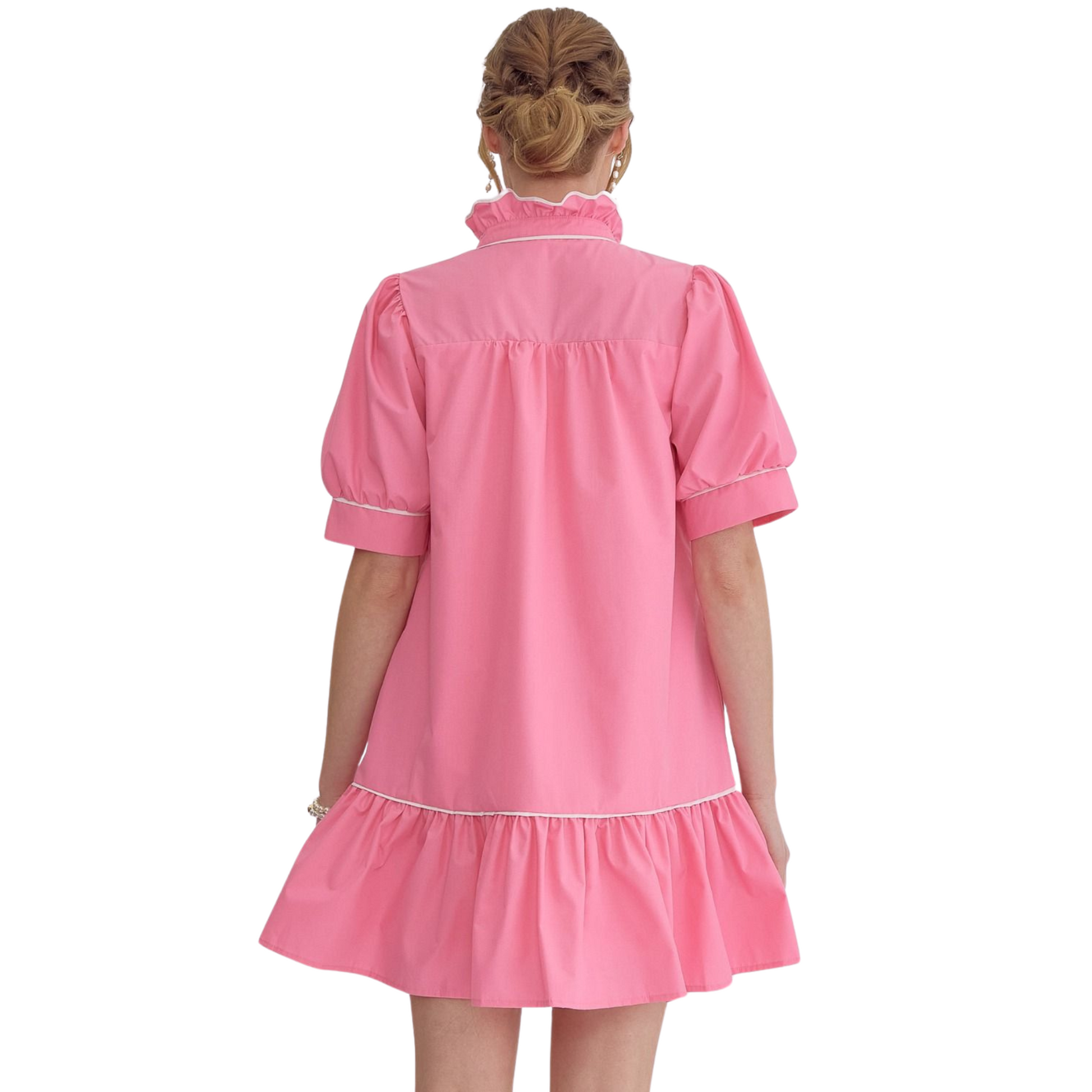 This solid high neck mini dress features a unique ruffled neckline and button up detail at the front. With convenient side pockets and a lightweight, non-sheer woven fabric, this dress is both stylish and practical. Its solid trim and lined design add extra sophistication.