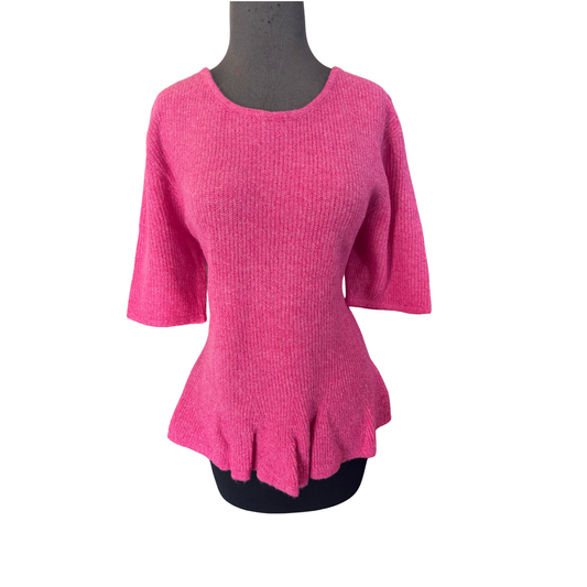 Elevate your casual wardrobe with this charming short sleeve plus sized peplum sweater from She+Sky. The soft pink hue brings a feminine touch to any outfit, while the flattering peplum silhouette adds dimension and style. Perfect for layering or wearing solo, this versatile top transitions seamlessly from day to night. Crafted for comfort and confidence, it's an essential piece for any fashion-forward closet.