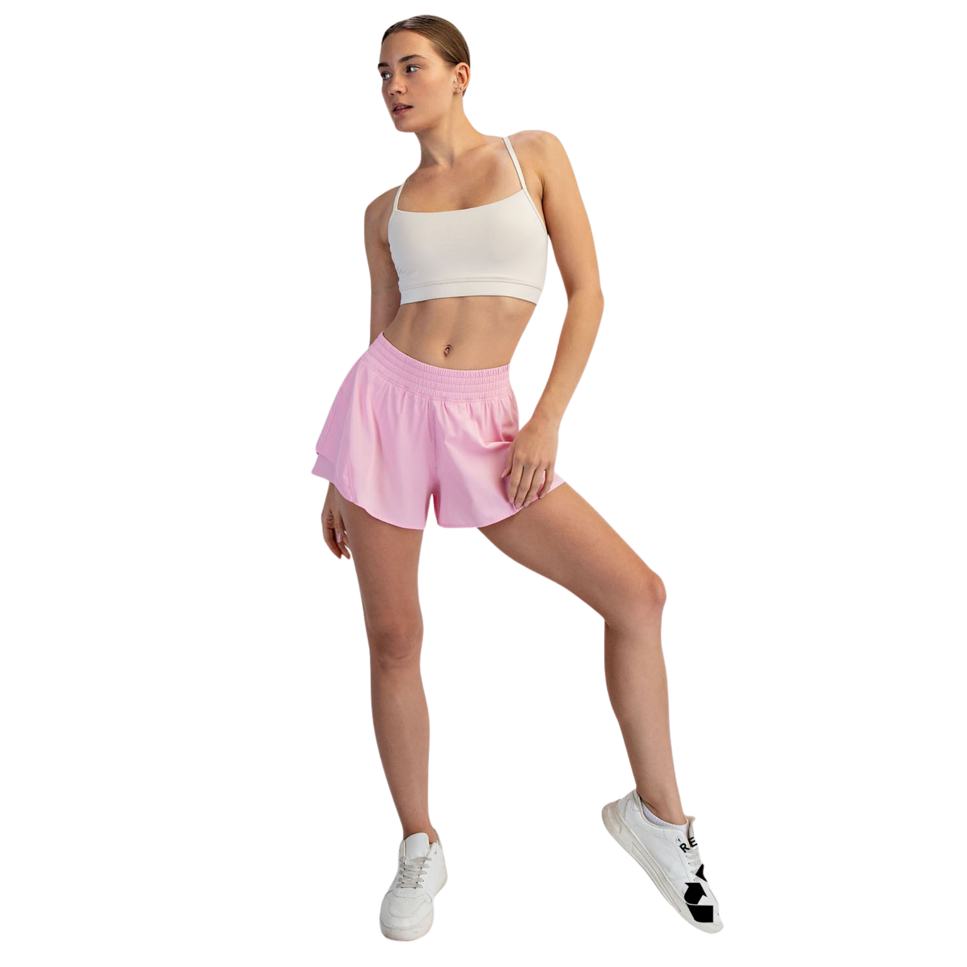 Elevate your active wardrobe with these A-Line Active Shorts from Rae Mode. Designed in a flattering sugar pink hue, these shorts feature a comfortable elastic waistband that moves with you through workouts, yoga, or casual everyday wear. The relaxed A-line silhouette provides freedom of movement while maintaining a polished look. Perfect for staying active in style.