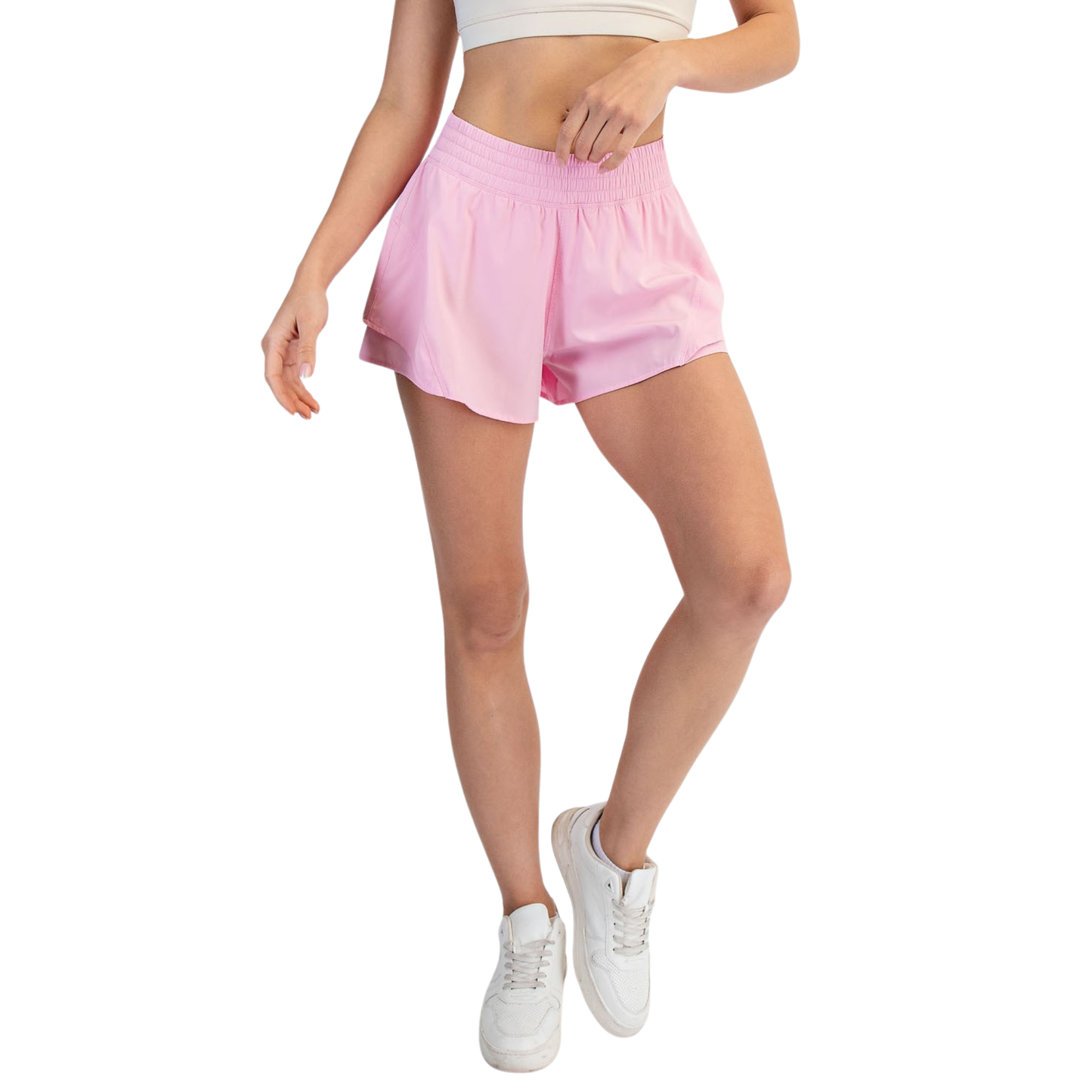 Elevate your active wardrobe with these A-Line Active Shorts from Rae Mode. Designed in a flattering sugar pink hue, these shorts feature a comfortable elastic waistband that moves with you through workouts, yoga, or casual everyday wear. The relaxed A-line silhouette provides freedom of movement while maintaining a polished look. Perfect for staying active in style.