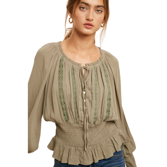 This Pintucked Smocked Lace Blouse is the perfect wardrobe addition for stylish spring looks. The taupe and green accents make the shirt subtly stand out, and the smocked waist creates a flattering silhouette that will flatter any figure. The long sleeve provides extra coverage, and the lace detail pairs perfectly with jeans or trousers.