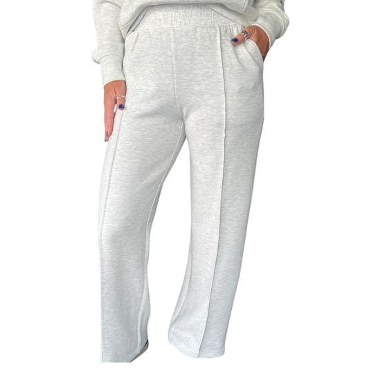 These Modal Pintuck Straight Pants in light heather grey combine sophisticated design with everyday comfort. Crafted from soft modal fabric, they feature a slim, straight cut with a subtle pintuck detail for a polished look. The adjustable drawstring waist ensures a customizable fit, making these pants versatile for both professional and casual settings. Durable and breathable, they offer ease of movement while maintaining a refined silhouette, perfect for those seeking style without sacrificing comfort. De