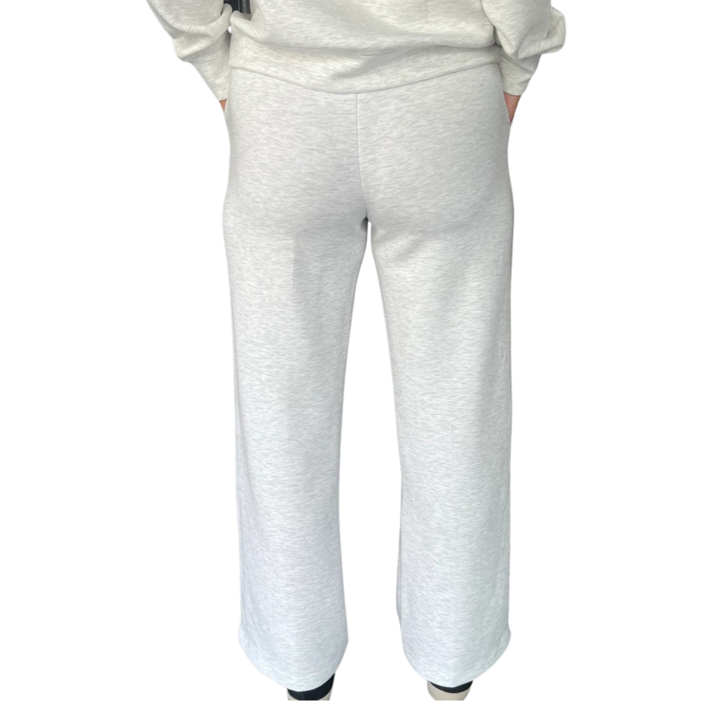 These Modal Pintuck Straight Pants in light heather grey combine sophisticated design with everyday comfort. Crafted from soft modal fabric, they feature a slim, straight cut with a subtle pintuck detail for a polished look. The adjustable drawstring waist ensures a customizable fit, making these pants versatile for both professional and casual settings. Durable and breathable, they offer ease of movement while maintaining a refined silhouette, perfect for those seeking style without sacrificing comfort. De