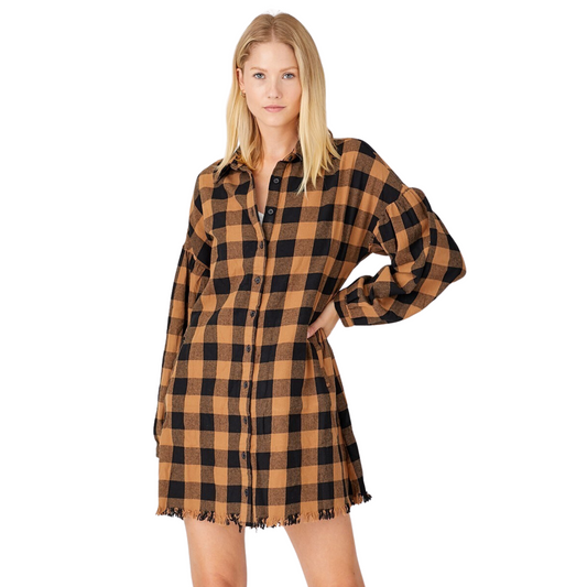 This Oversized Plaid Shirt Dress is the perfect blend of style and comfort. The plaid pattern is timeless and features a mini dress length, long sleeve design, and a sleek black and sand color. You'll look polished and put-together in this classic piece.