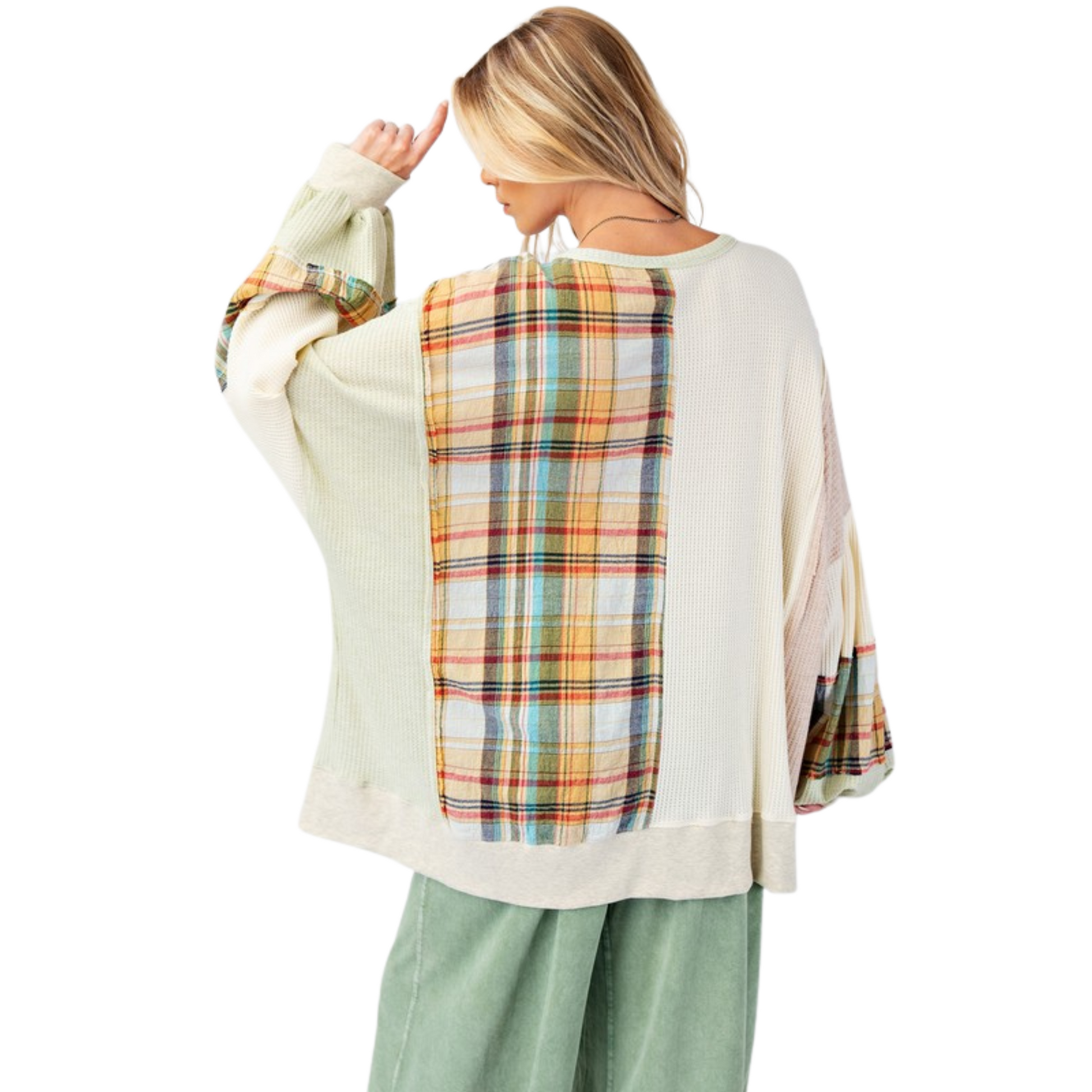 Expertly crafted with a thermal knit fabric, our Plaid Mix Oversized Top features bubble sleeves, a rounded neckline, and ribbed band cuffs for a relaxed and oversized fit. The raised front flower patches and raw cut seams add a touch of unique detailing, while the side slits and color block plaid pattern provide both style and comfort. Made for all sizes.