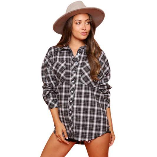 You'll be rocking out in style in this Plaid Rock &amp; Roll Shacket. With a stylish plaid pattern and button up design, this long sleeve shacket is an ideal way to add a cool, hard-rocking touch to any look.