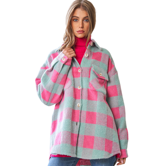 The Plaid Button Down Shacket features multi-checker plaid, chest pockets, and a button-down shirt jacket design in pink and grey. The shacket is made from high-quality, breathable materials for comfort and durability.