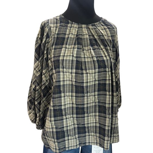 This navy plaid top from GiGio combines classic patterning with modern style, featuring pleated details that add texture and sophistication. Its 3/4 length sleeves offer a versatile fit for layering or standalone wear, making it ideal for both professional and casual settings. The tailored design provides a polished look while ensuring comfort throughout the day.