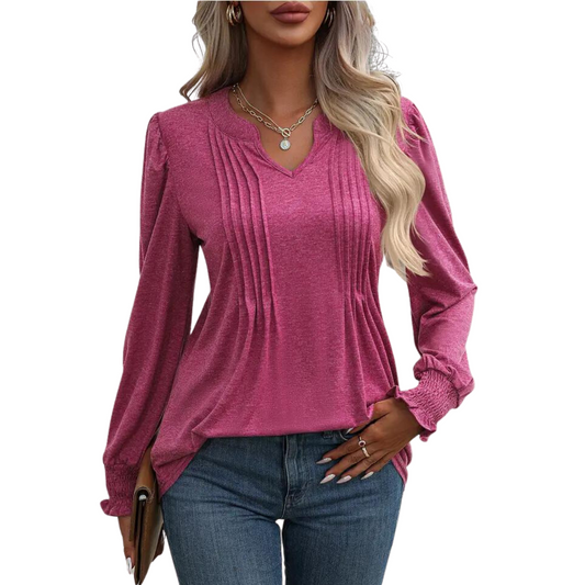 This Pleated V-Neck Babydoll Top features a deep rose color, long smocked sleeves, and attractive pleated detail. Its relaxed shape and timeless style make it perfect for casual or formal occasions.