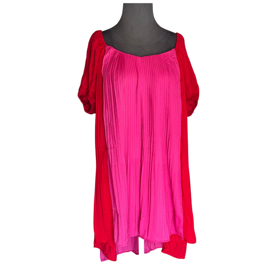 This TCEC Pleated Two-Toned Mini Dress offers a bold and stylish addition to your wardrobe. The pleated design adds texture and movement, while the red and pink colors bring a touch of vibrancy. Perfect for any occasion, this mini dress is a must-have for fashion-forward individuals.