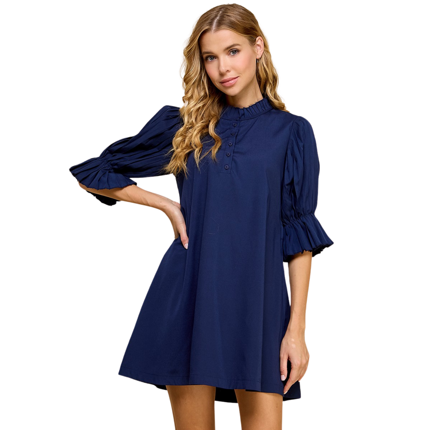 Expertly crafted by T.C.E.C., this navy shift dress features pleated sleeves and neckline, with a button up detail and adjustable back tie. Its classic design offers a versatile look that can be dressed up or down, perfect for any occasion. Elevate your wardrobe with this stylish and timeless mini dress.