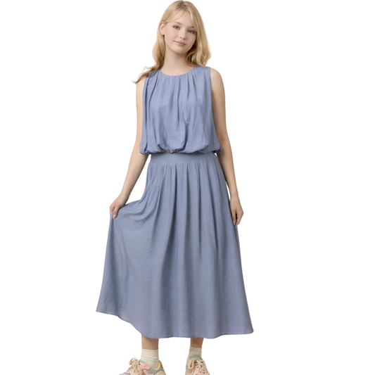 Elevate your wardrobe with this chic Very J two-piece set featuring a sleeveless cropped blouse paired with a flattering midi skirt. The denim color creates a timeless, versatile look perfect for casual outings or dressed-up occasions. The pleated bubble blouse adds dimension and movement, while the midi skirt offers a modern silhouette that balances the cropped top. Mix and match with your favorite accessories for endless styling possibilities. A must-have set for effortless, put-together style.