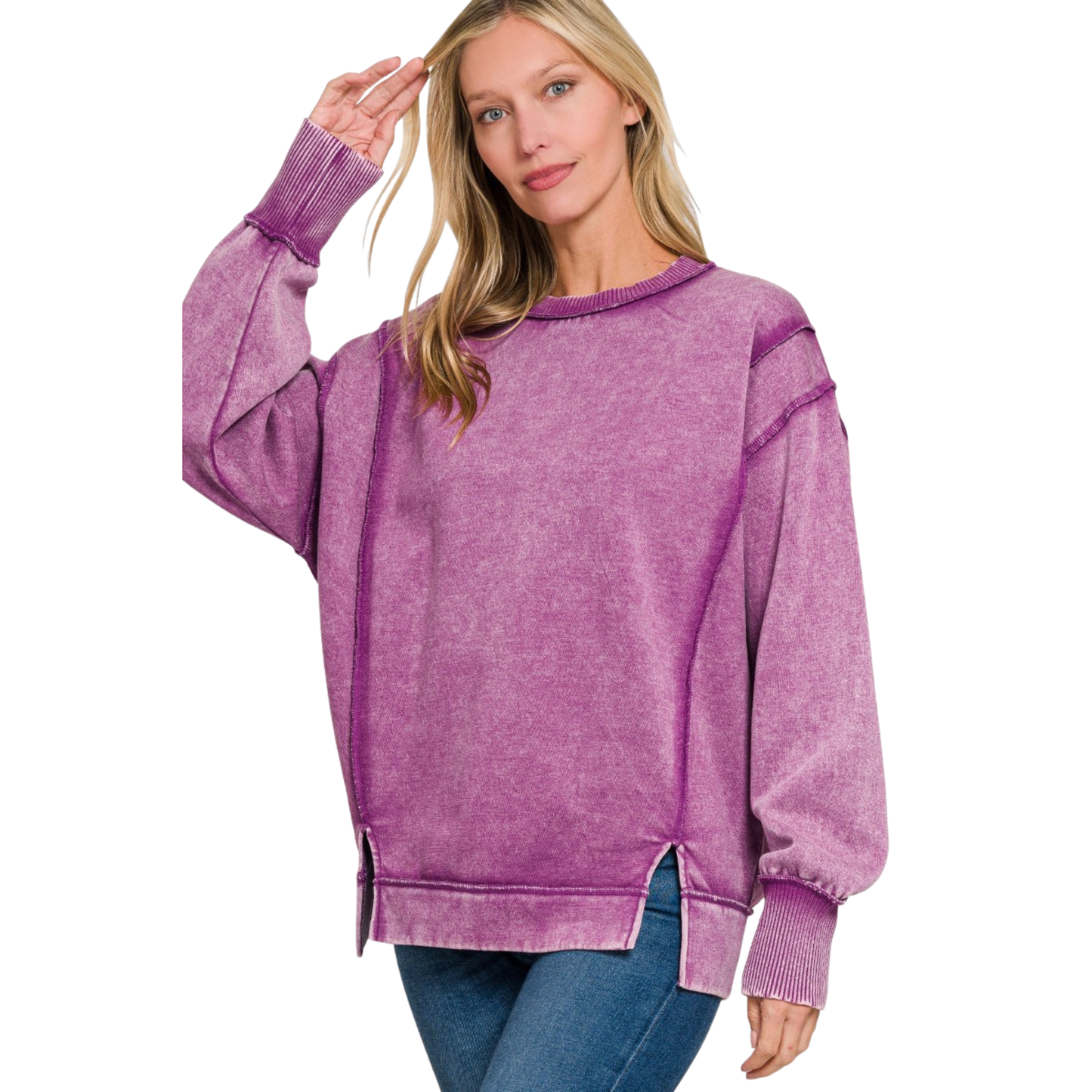 Elevate your casual wardrobe with this Zenana acid-washed fleece sweatshirt in a sophisticated light plum hue. The long sleeves provide warmth and coverage, while exposed seams add an intentional design detail that speaks to contemporary styling. Practical side slits enhance mobility and create a modern silhouette. Crafted from quality fleece, this piece balances comfort with understated elegance, making it an essential layering option for any season.