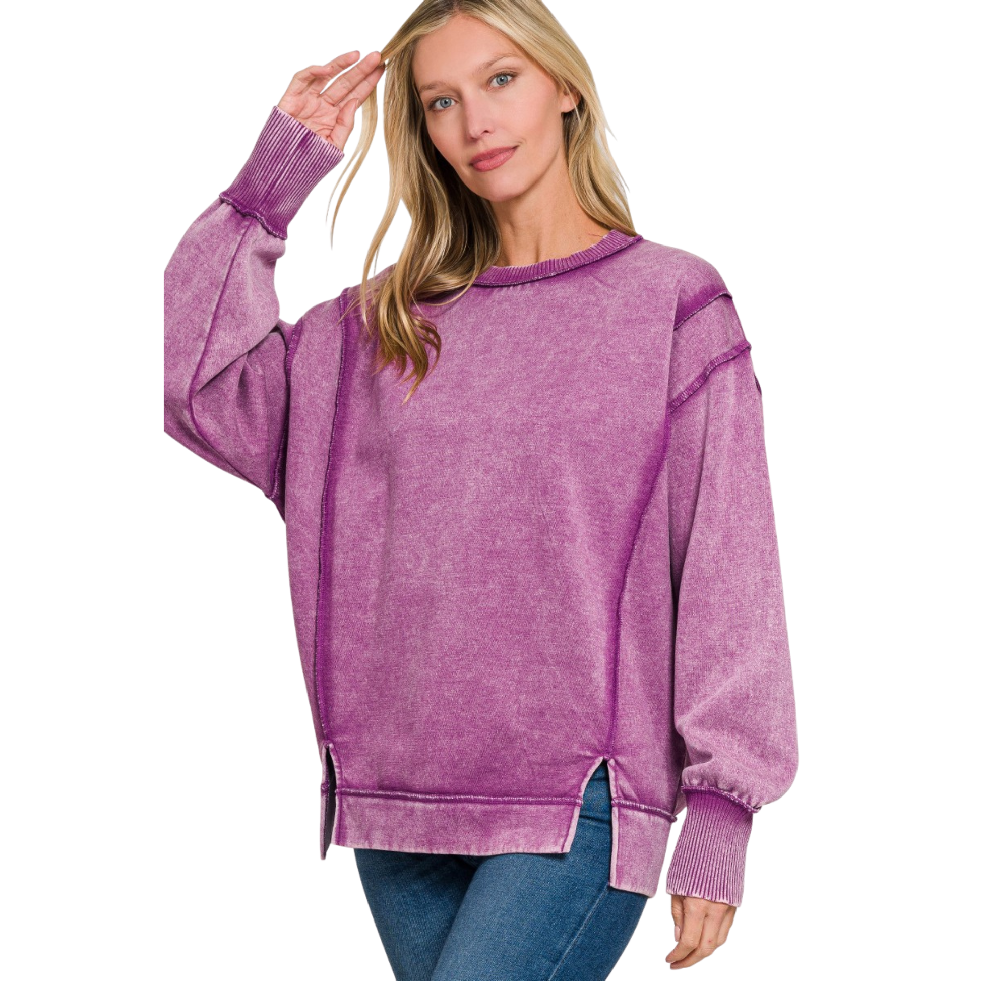 Elevate your casual wardrobe with this Zenana acid-washed fleece sweatshirt in a sophisticated light plum hue. The long sleeves provide warmth and coverage, while exposed seams add an intentional design detail that speaks to contemporary styling. Practical side slits enhance mobility and create a modern silhouette. Crafted from quality fleece, this piece balances comfort with understated elegance, making it an essential layering option for any season.