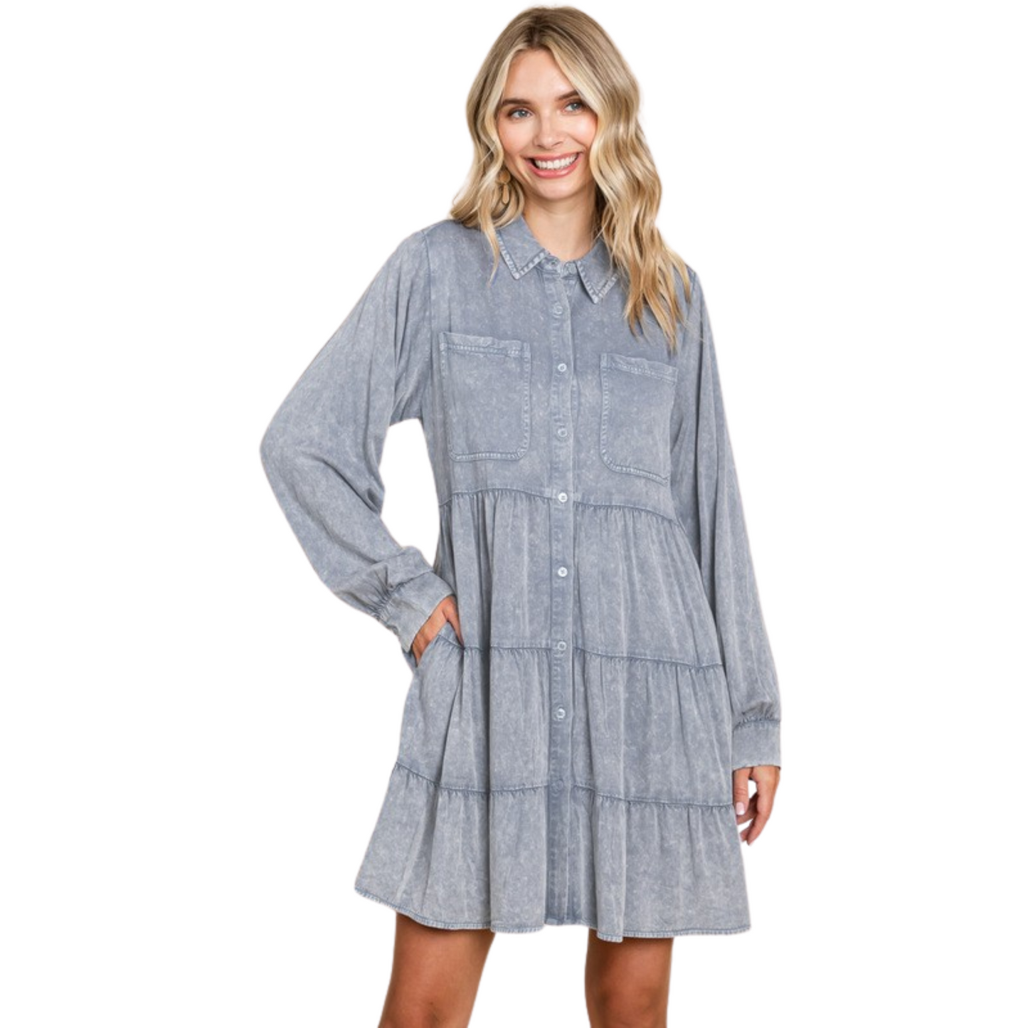 Introducing the Washed Babydoll Dress With Pockets. This dress is crafted from washed material for a unique look. Features include a collared neck, chest pockets, long shirt sleeves, and tiered layers with wrinkle detail. Plus size available in Denim color. Unlined, non-sheer, and lightweight for an exceptionally comfortable fit.