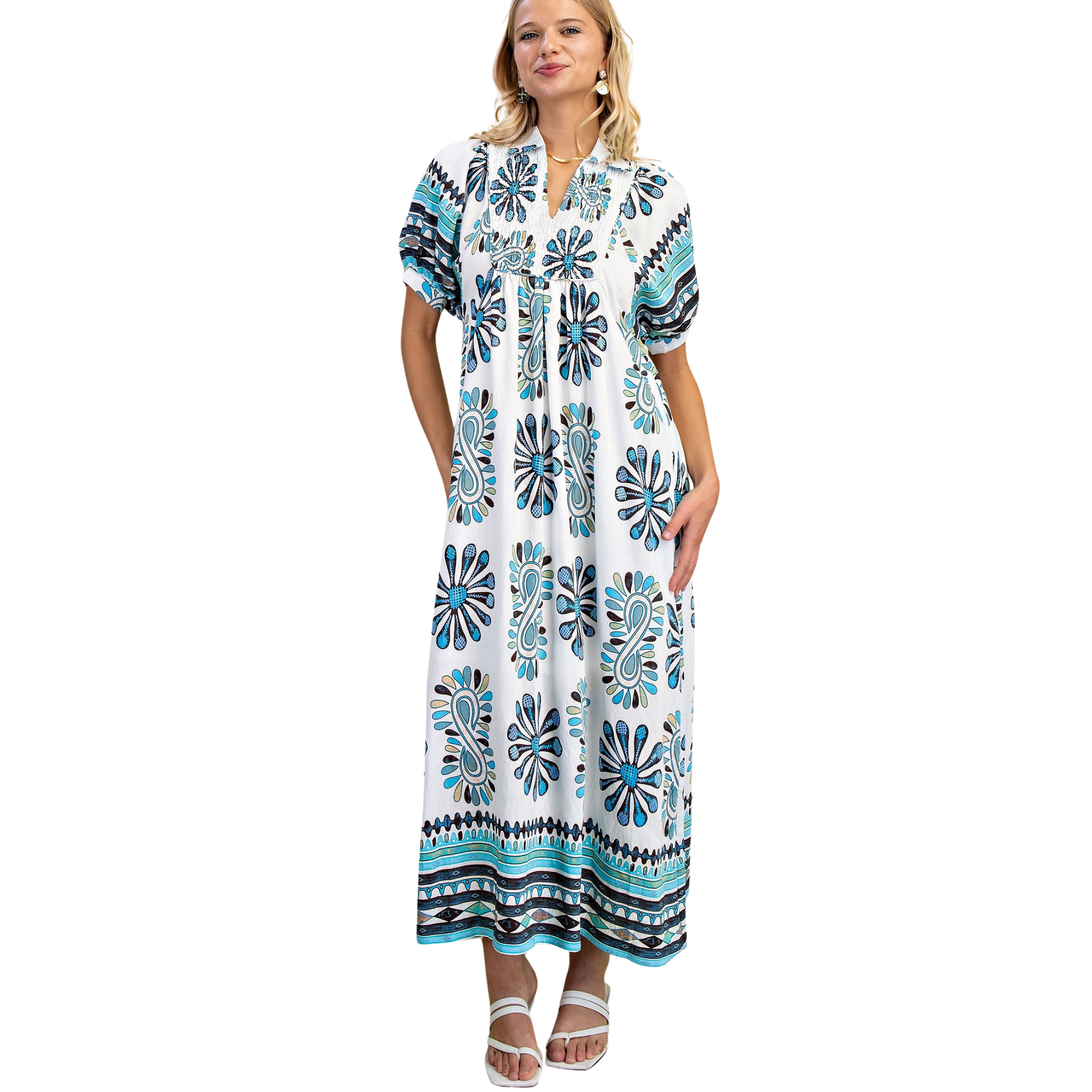 Elevate your everyday style with this stunning Smocked Yoke Midi Dress by GiGio. Crafted in a beautiful blue mix, this midi-length dress features a flattering v-neckline and comfortable short sleeves, perfect for transitional seasons. The intricate smocked yoke detail adds texture and visual interest to the bodice, creating a sophisticated silhouette that works beautifully for casual outings or dressed-up occasions. The midi length offers timeless elegance while remaining effortlessly wearable. A versatile 