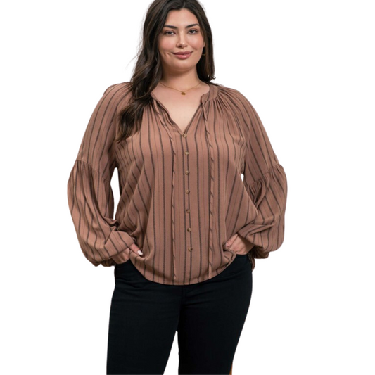 This plus size Striped Peasant Top is perfect for the transition into cooler seasons. Crafted with a split neckline and tie neck, this top features long sleeves and nonfunctional buttons for a unique look. The classic striped pattern makes it ideal for any occasion.