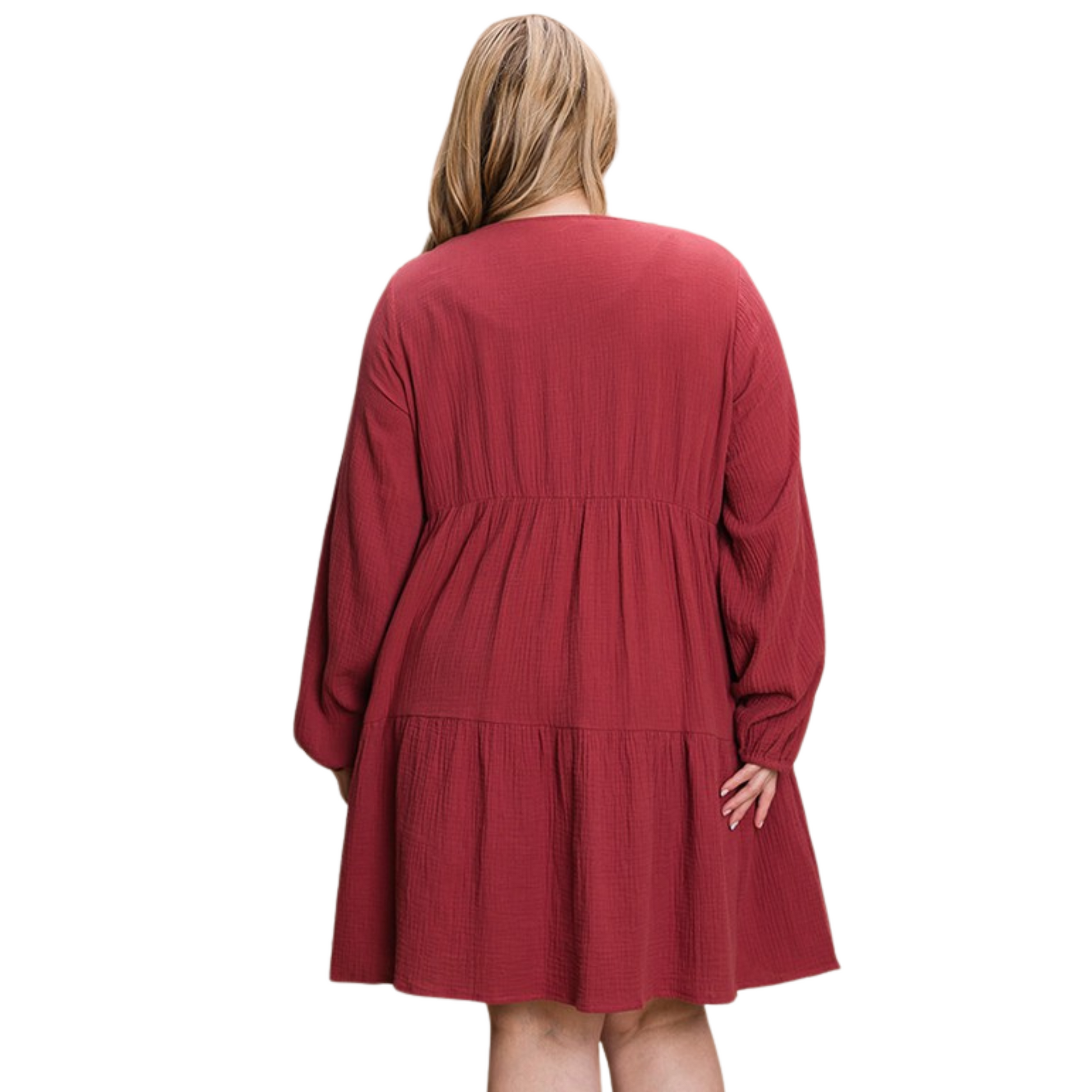 Our Tiered Dress in a beautiful crimson color is perfect for any occasion. This plus size mini dress is sure to add a touch of sophistication to your wardrobe with its long sleeves and front buttons.