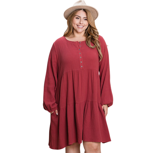 Our Tiered Dress in a beautiful crimson color is perfect for any occasion. This plus size mini dress is sure to add a touch of sophistication to your wardrobe with its long sleeves and front buttons.