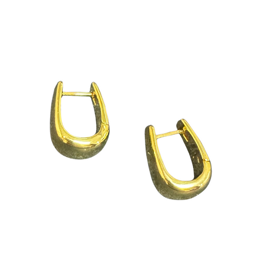 Upgrade your accessory game with these elegant Polished Elongated Huggie hoop earrings from Amanda blu. Made with high-quality gold, these earrings are perfect for adding a touch of luxury to any outfit. Their elongated shape adds a unique twist to the classic huggie style, making them a must-have for any fashion-forward individual.