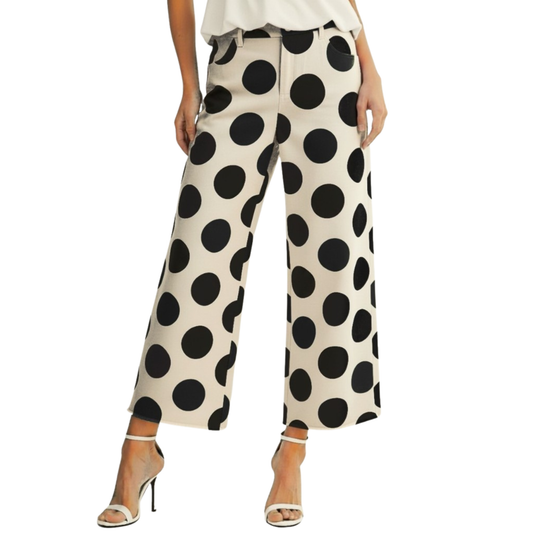 Elevate your casual wardrobe with these striking Polka Dot Trouser Pants from LovLov. Featuring a crisp ivory base adorned with bold black polka dots, this cropped silhouette offers a playful yet sophisticated look. Perfect for pairing with minimalist tops or statement pieces, these pants bring effortless style to any outfit. The tailored fit flatters while the cropped length keeps things modern and on-trend.