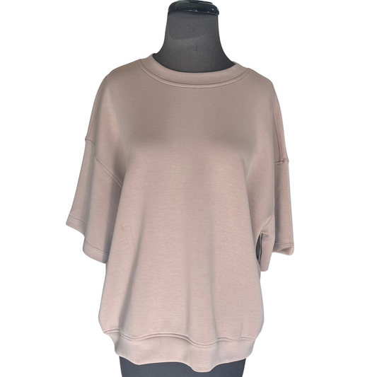 This Poly Span Short Sleeve Top from Rae Mode features a soft light mocha color that complements any wardrobe. Its lightweight, stretchy fabric ensures comfortable all-day wear, while the short sleeves provide a cool, breathable fit. Ideal for layering or wearing alone, this top combines style and function effortlessly.
